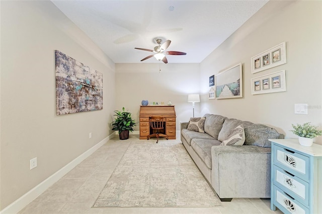 13711 Messina Loop Unit 102, Lakewood Ranch, FL 34211 - living area with ceiling fan, light tile patterned flooring, and baseboards