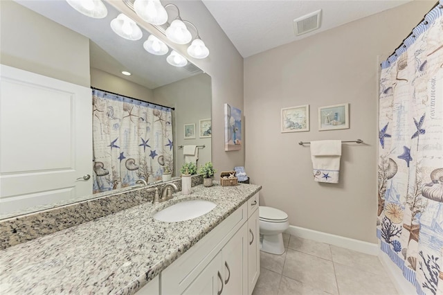 13711 Messina Loop Unit 102, Lakewood Ranch, FL 34211 - full bath with toilet, vanity, baseboards, tile patterned flooring, and curtained shower