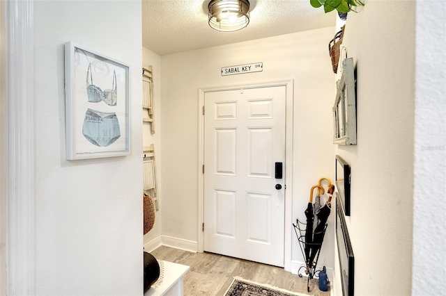 4727 Sabal Key Dr Unit 4727, Bradenton, FL 34203 - foyer with light wood-style floors and a textured ceiling