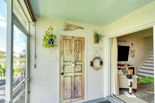4727 Sabal Key Dr Unit 4727, Bradenton, FL 34203 - property entrance featuring a water view and stucco siding