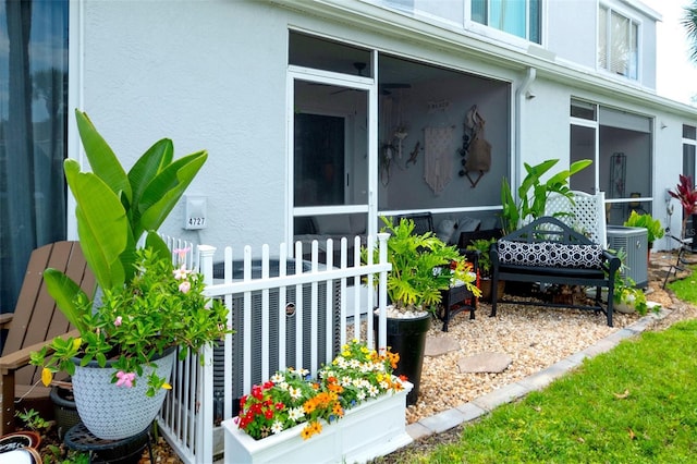 4727 Sabal Key Dr Unit 4727, Bradenton, FL 34203 - view of home's exterior with a sunroom and stucco siding