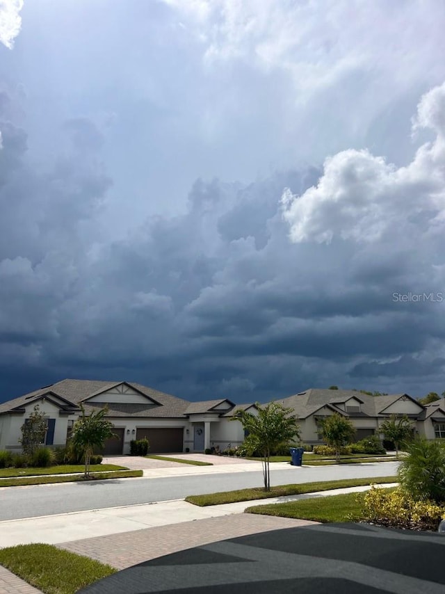 9808 Campanula Ct, Land O Lakes, FL 34637 - view of asphalt road with a residential view and sidewalks