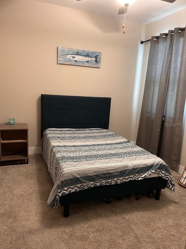 9808 Campanula Ct, Land O Lakes, FL 34637 - carpeted bedroom featuring ceiling fan and baseboards