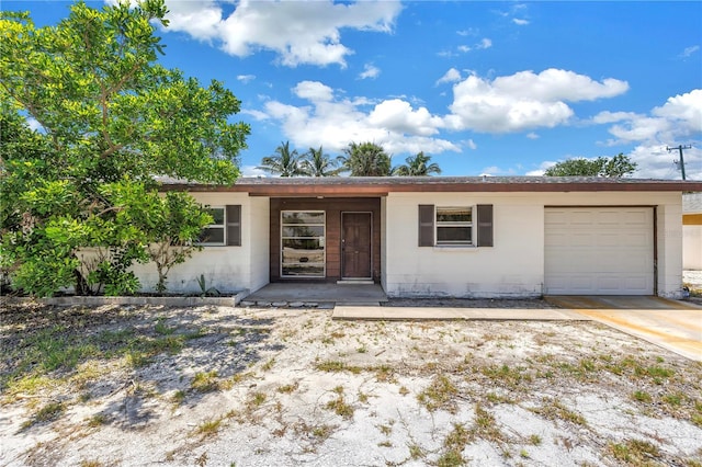 310 Avenida Milano, Sarasota, FL 34242 - ranch-style house with concrete block siding and an attached garage