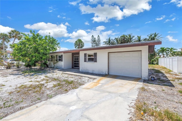 310 Avenida Milano, Sarasota, FL 34242 - ranch-style house featuring an attached garage and driveway