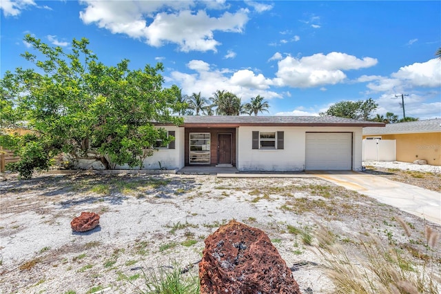 310 Avenida Milano, Sarasota, FL 34242 - ranch-style home with an attached garage, driveway, and stucco siding