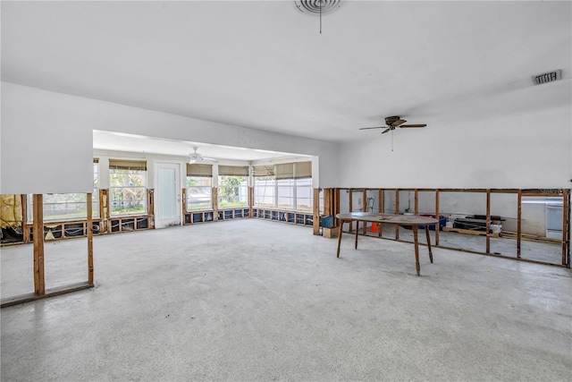 310 Avenida Milano, Sarasota, FL 34242 - living room featuring a ceiling fan, concrete floors, and healthy amount of natural light