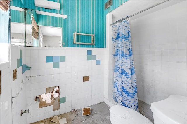 310 Avenida Milano, Sarasota, FL 34242 - full bathroom with tile walls, a shower stall, and toilet