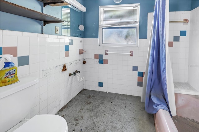 310 Avenida Milano, Sarasota, FL 34242 - bathroom with toilet, tile walls, and wainscoting