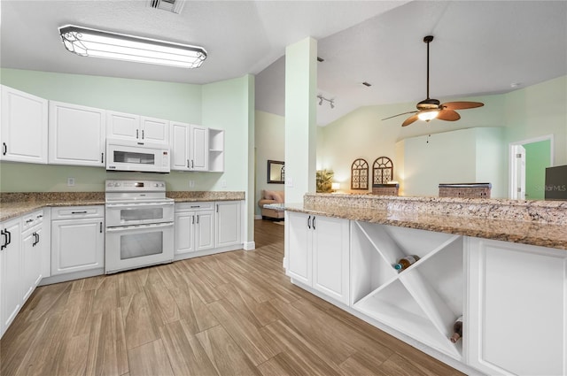1612 Fairway Oaks Dr, Palmetto, FL 34221 - kitchen with open shelves, white appliances, ceiling fan, white cabinets, and high vaulted ceiling