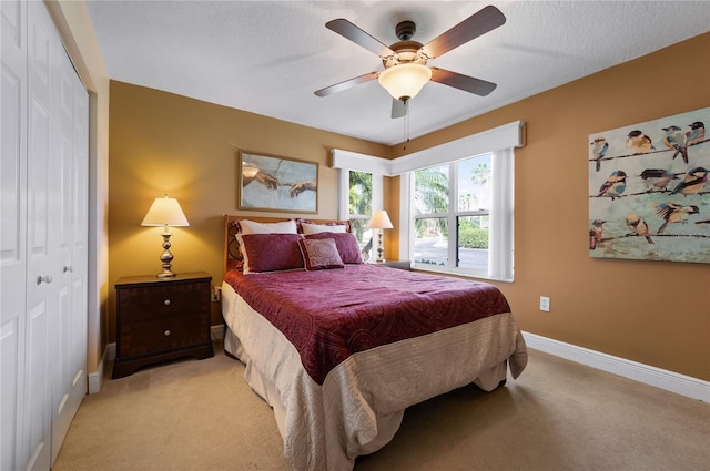 1612 Fairway Oaks Dr, Palmetto, FL 34221 - bedroom with a closet, light carpet, baseboards, and a ceiling fan