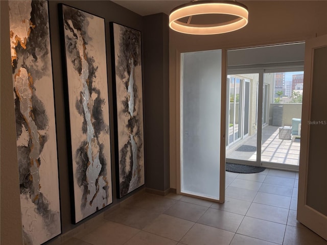 1345 2nd St, Sarasota, FL 34236 - empty room with light tile patterned floors and baseboards
