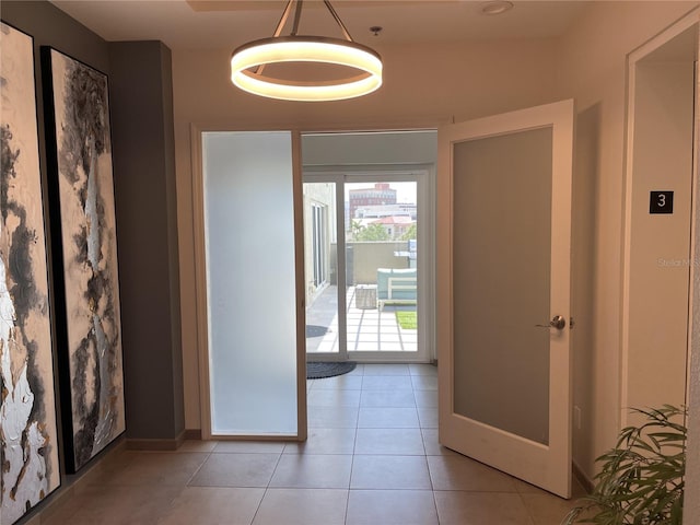 1345 2nd St, Sarasota, FL 34236 - foyer with light tile patterned flooring and baseboards