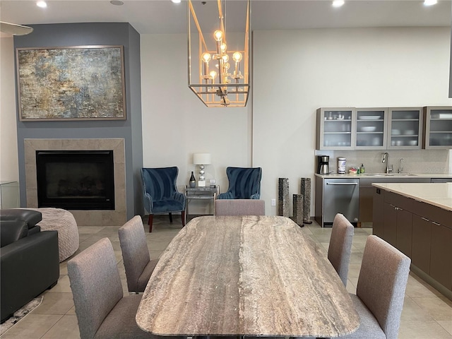 1345 2nd St, Sarasota, FL 34236 - dining space with recessed lighting, light tile patterned flooring, a fireplace, and a chandelier