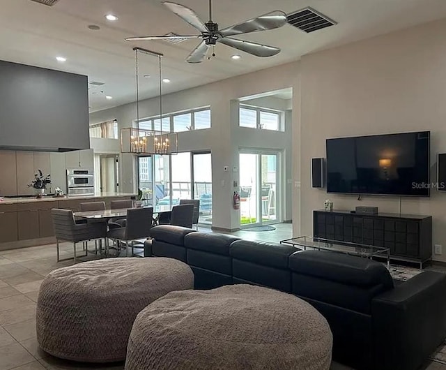 1345 2nd St, Sarasota, FL 34236 - living area featuring ceiling fan, recessed lighting, a chandelier, a high ceiling, and light tile patterned floors
