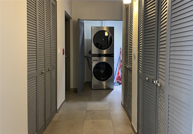 1345 2nd St, Sarasota, FL 34236 - washroom featuring stacked washer / drying machine and baseboards