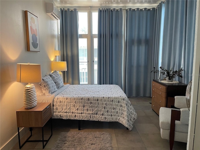 1345 2nd St, Sarasota, FL 34236 - tiled bedroom with a wall mounted AC and baseboards