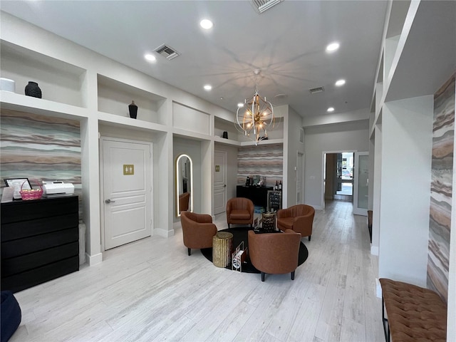 1345 2nd St, Sarasota, FL 34236 - living room featuring a chandelier, baseboards, recessed lighting, and light wood-style flooring