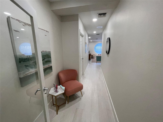 1345 2nd St, Sarasota, FL 34236 - hall with light wood-type flooring, baseboards, and recessed lighting