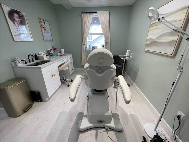 1345 2nd St, Sarasota, FL 34236 - bathroom featuring toilet, wood finished floors, a sink, and baseboards