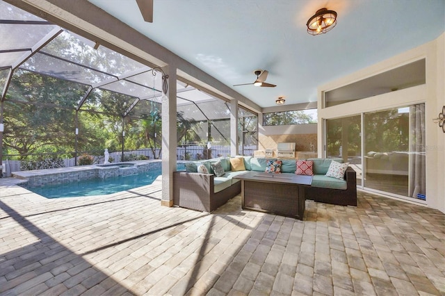 9016 30th St E, Parrish, FL 34219 - sunroom / solarium with ceiling fan, outdoor lounge area, an outdoor kitchen, and a hot tub