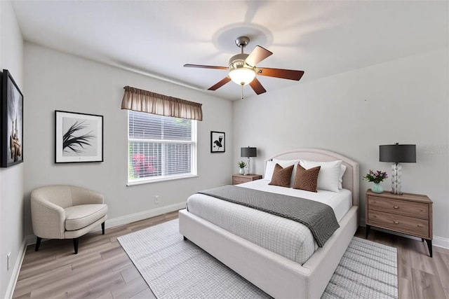9016 30th St E, Parrish, FL 34219 - bedroom with baseboards, light wood-style flooring, and a ceiling fan