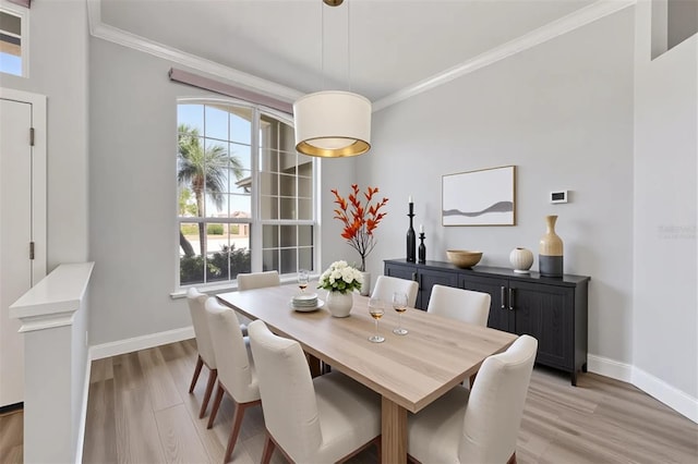 9016 30th St E, Parrish, FL 34219 - dining area featuring light wood-type flooring, ornamental molding, and baseboards