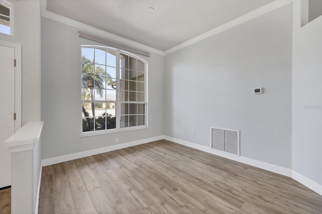 9016 30th St E, Parrish, FL 34219 - empty room featuring ornamental molding, wood finished floors, and baseboards