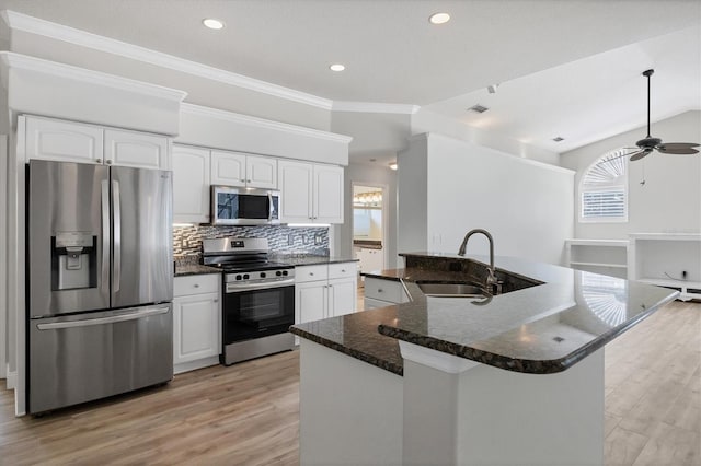 9016 30th St E, Parrish, FL 34219 - kitchen featuring stainless steel appliances, a sink, healthy amount of natural light, light wood-style flooring, and crown molding