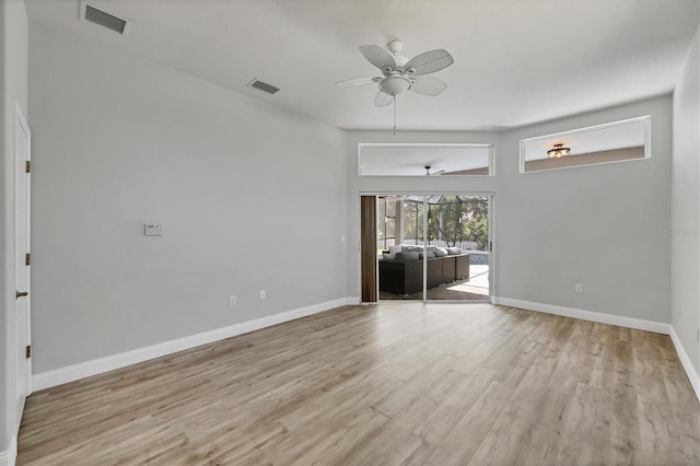 9016 30th St E, Parrish, FL 34219 - spare room with a ceiling fan, light wood-style floors, and baseboards