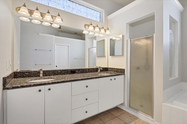 9016 30th St E, Parrish, FL 34219 - bathroom featuring a stall shower, double vanity, a bath, and tile patterned flooring