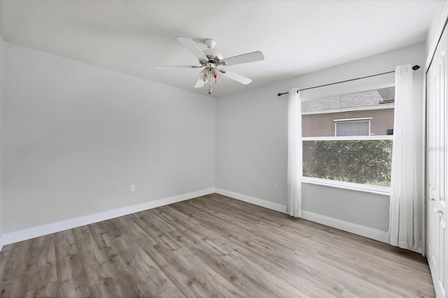 9016 30th St E, Parrish, FL 34219 - unfurnished room featuring wood finished floors, ceiling fan, and baseboards
