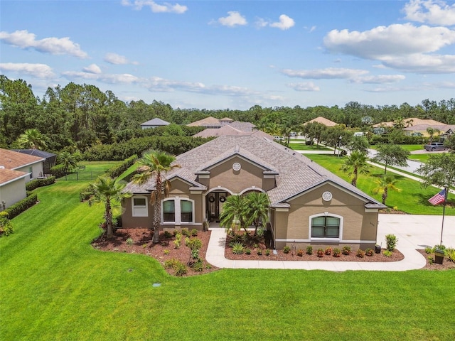 16246 26th St E, Parrish, FL 34219 - view of front facade featuring stucco siding and a front yard