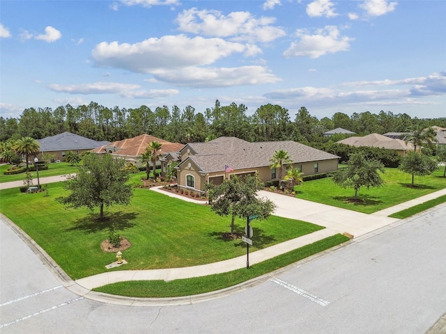 16246 26th St E, Parrish, FL 34219 - ranch-style house featuring concrete driveway, a front yard, and a garage
