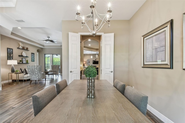 16246 26th St E, Parrish, FL 34219 - dining area with a tray ceiling, baseboards, wood finished floors, ornamental molding, and recessed lighting