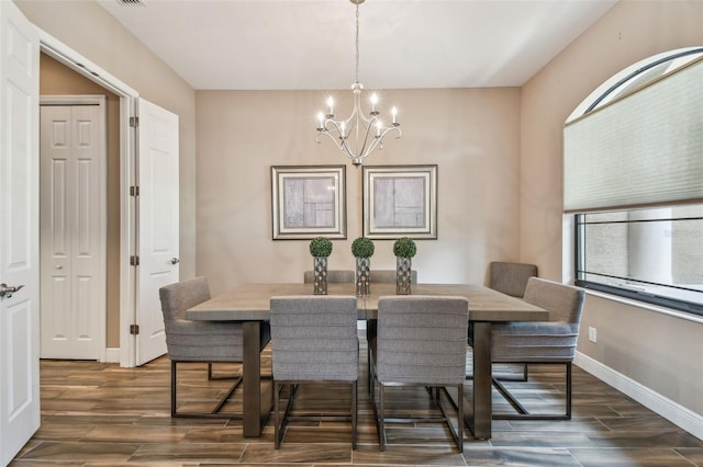 16246 26th St E, Parrish, FL 34219 - dining space with a chandelier, wood finished floors, and baseboards