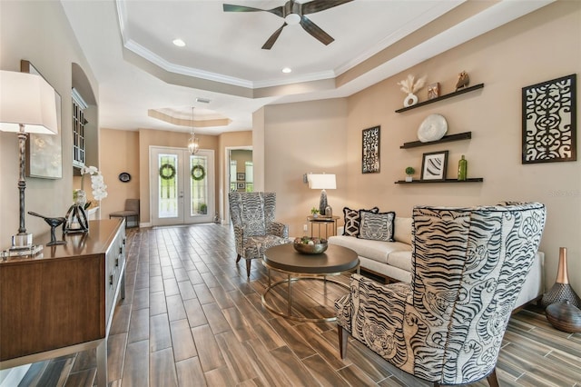 16246 26th St E, Parrish, FL 34219 - living area featuring ceiling fan, a raised ceiling, recessed lighting, wood tiled floors, and crown molding