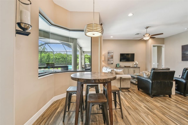 16246 26th St E, Parrish, FL 34219 - dining room featuring wood finished floors, recessed lighting, ceiling fan, and baseboards