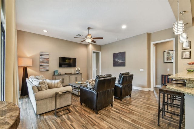 16246 26th St E, Parrish, FL 34219 - living room with ceiling fan, wood finished floors, baseboards, and recessed lighting