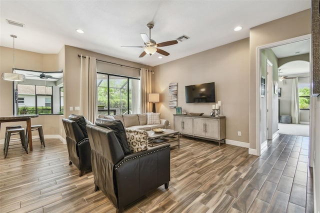 16246 26th St E, Parrish, FL 34219 - living room with a ceiling fan, wood finished floors, plenty of natural light, baseboards, and recessed lighting