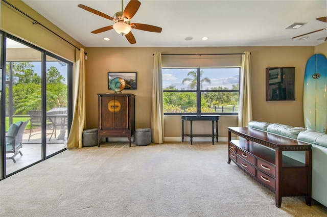 16246 26th St E, Parrish, FL 34219 - carpeted living room with plenty of natural light, ceiling fan, baseboards, and recessed lighting