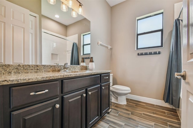 16246 26th St E, Parrish, FL 34219 - bathroom featuring vanity, baseboards, curtained shower, toilet, and wood finished floors