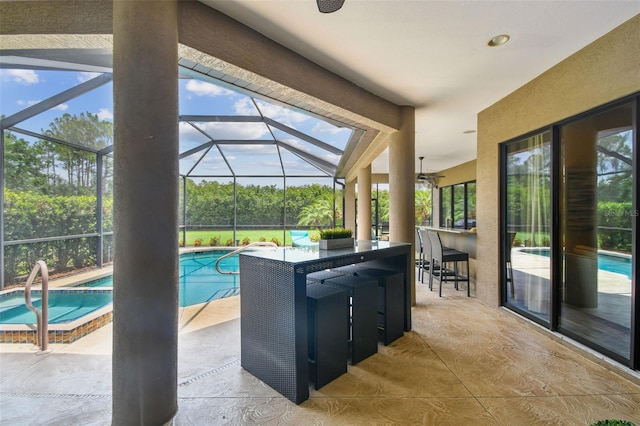 16246 26th St E, Parrish, FL 34219 - view of patio featuring an in-ground hot tub, an outdoor pool, and glass enclosure