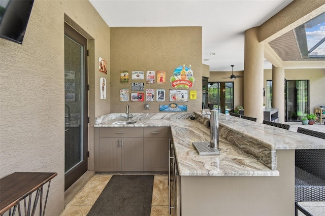 16246 26th St E, Parrish, FL 34219 - indoor wet bar with ceiling fan, a textured wall, and healthy amount of natural light