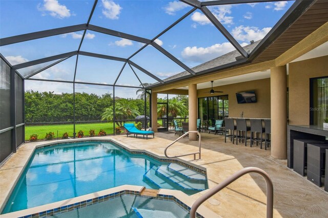 16246 26th St E, Parrish, FL 34219 - view of pool with a patio area, a pool with connected hot tub, a ceiling fan, and a lanai