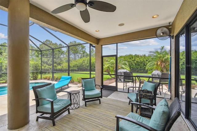 16246 26th St E, Parrish, FL 34219 - sunroom with ceiling fan, view of wooded area, and healthy amount of natural light