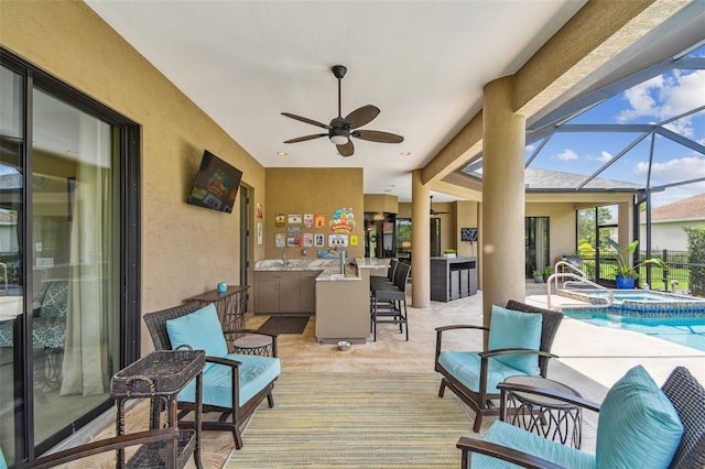 16246 26th St E, Parrish, FL 34219 - wooden deck with a bar, glass enclosure, ceiling fan, and a pool with connected hot tub