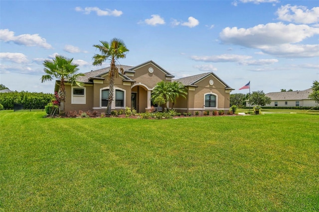 16246 26th St E, Parrish, FL 34219 - mediterranean / spanish-style house with stucco siding and a front lawn