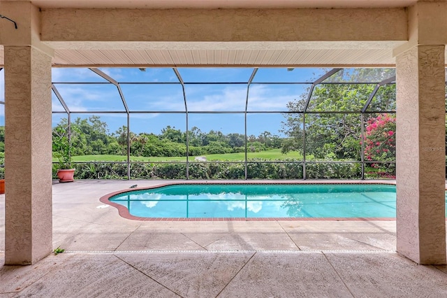 3388 Highlands Bridge Rd, Sarasota, FL 34235 - outdoor pool with a patio, view of scattered trees, and a lanai