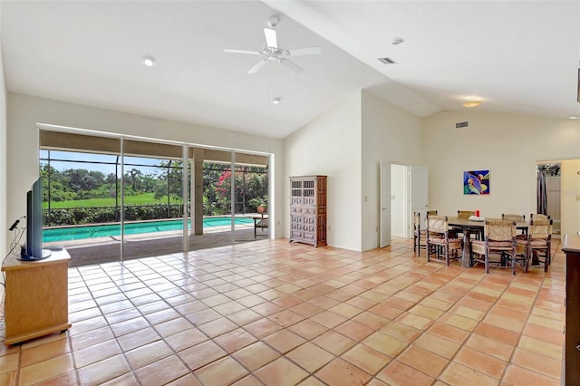 3388 Highlands Bridge Rd, Sarasota, FL 34235 - living area featuring ceiling fan, high vaulted ceiling, plenty of natural light, and light tile patterned floors